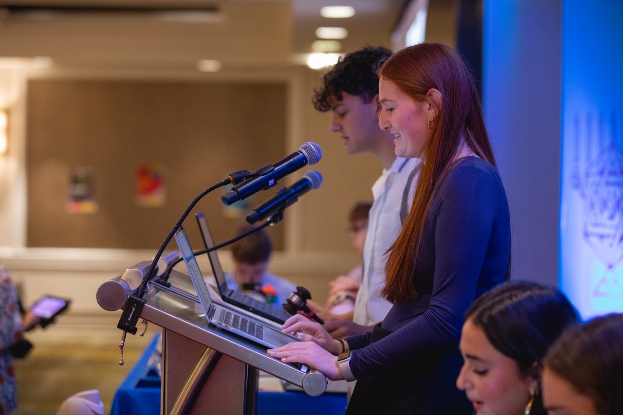 Group of people celebrating on stage