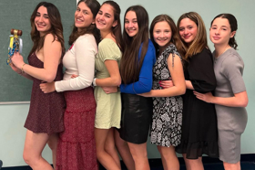 Group of people celebrating on stage