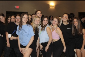 Group of people celebrating on stage