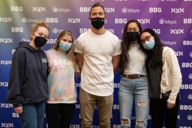 Group of people celebrating on stage