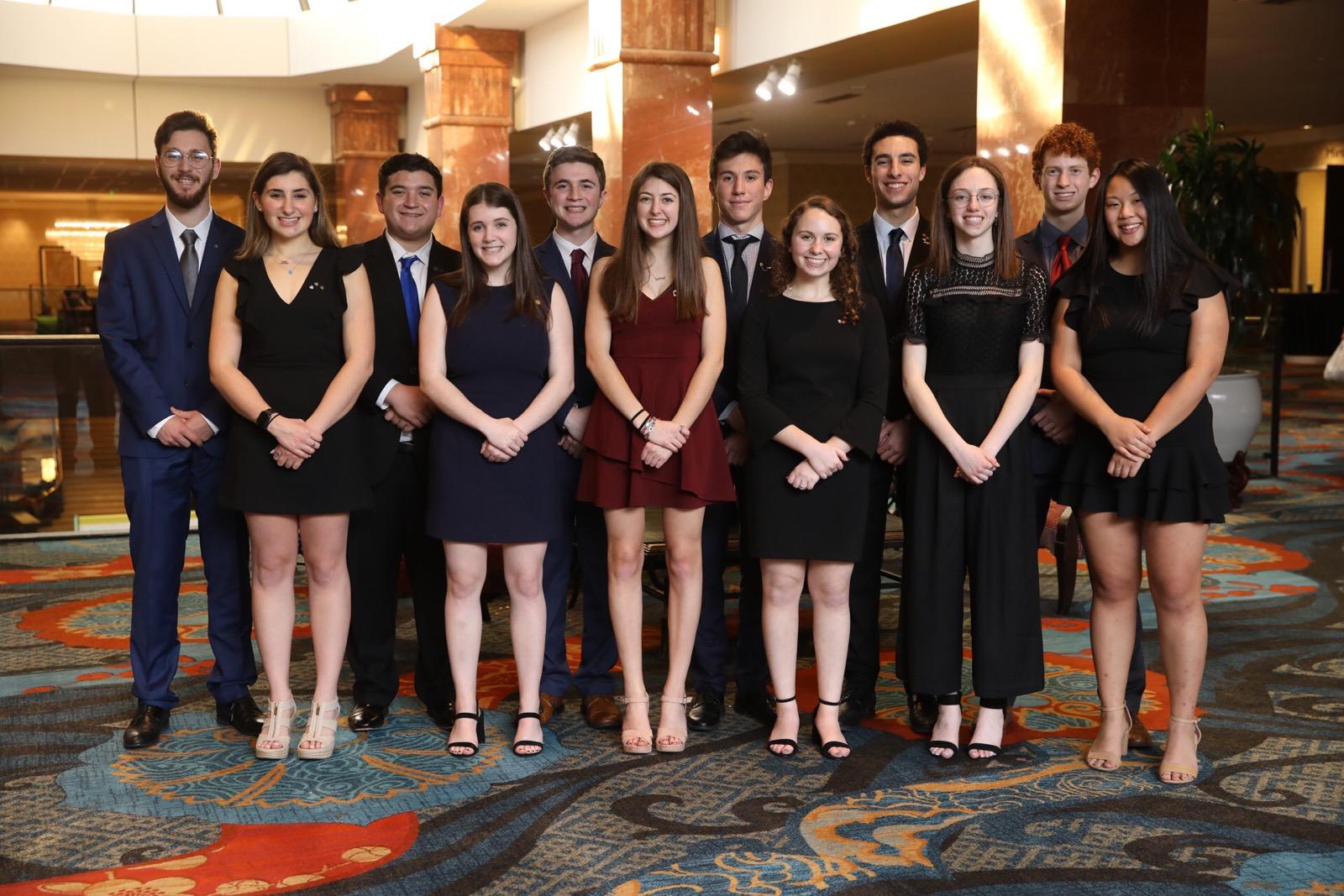 Group of people celebrating on stage
