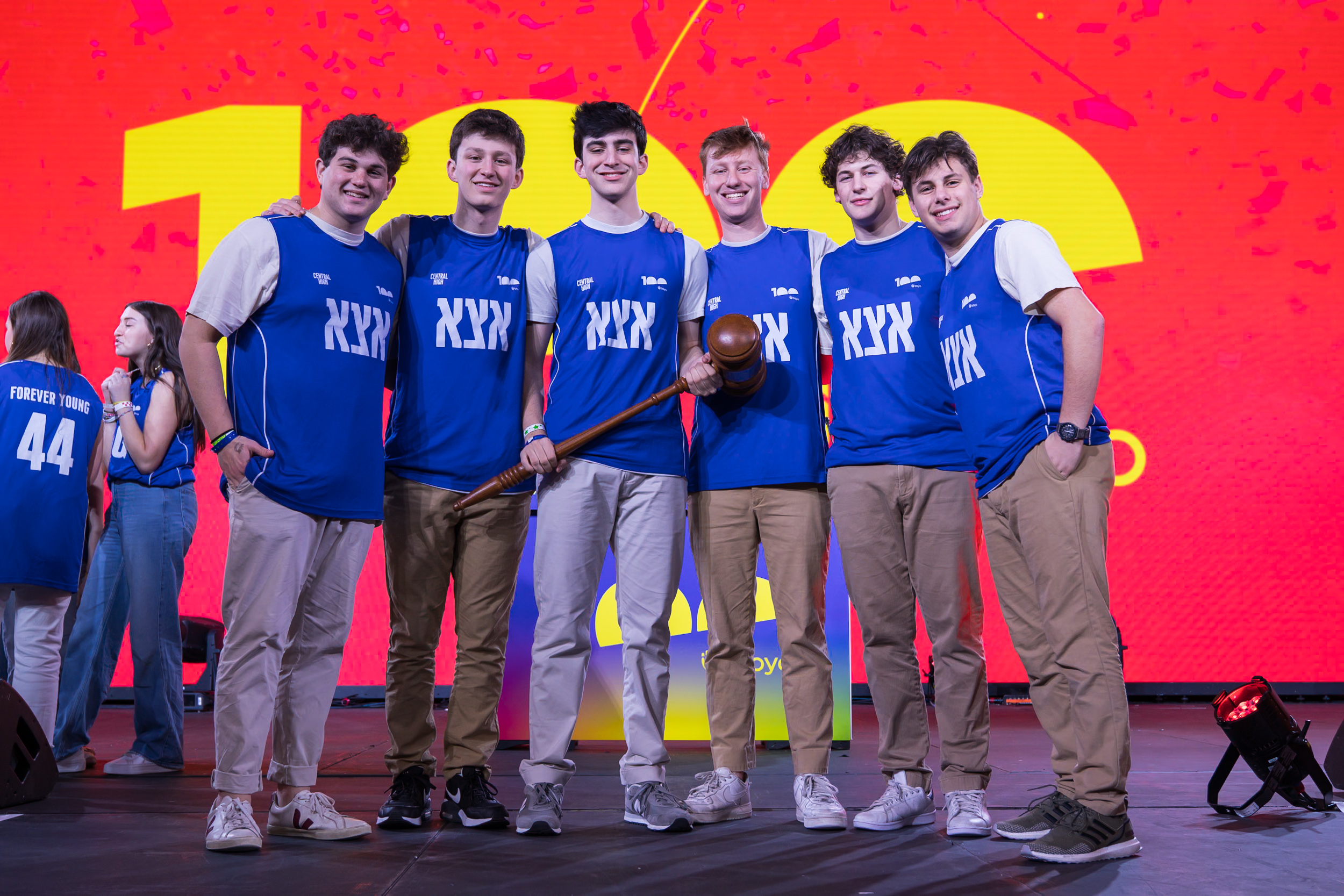 Group of people celebrating on stage