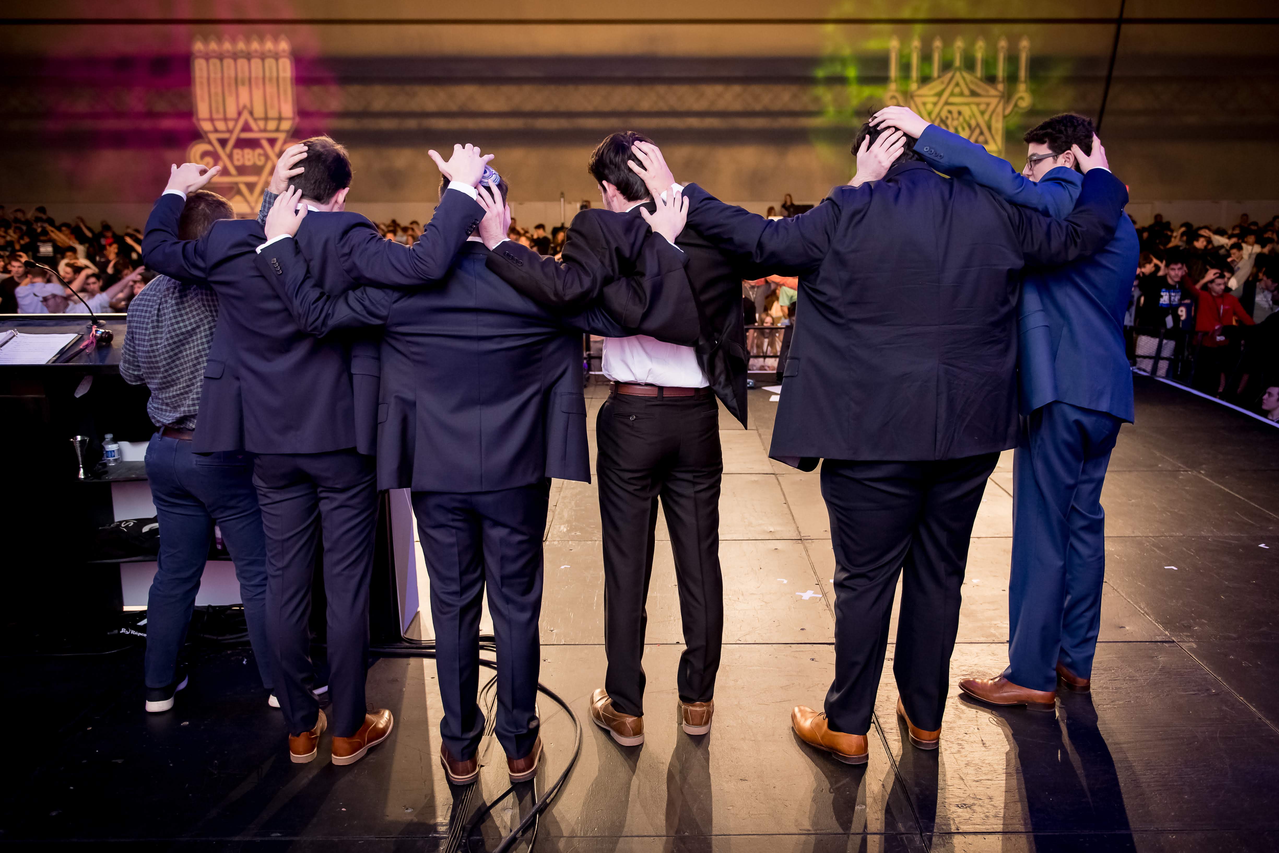Group of people celebrating on stage