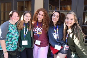 Group of people celebrating on stage