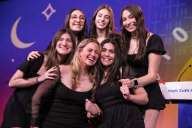 Group of people celebrating on stage