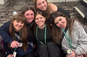 Group of people celebrating on stage