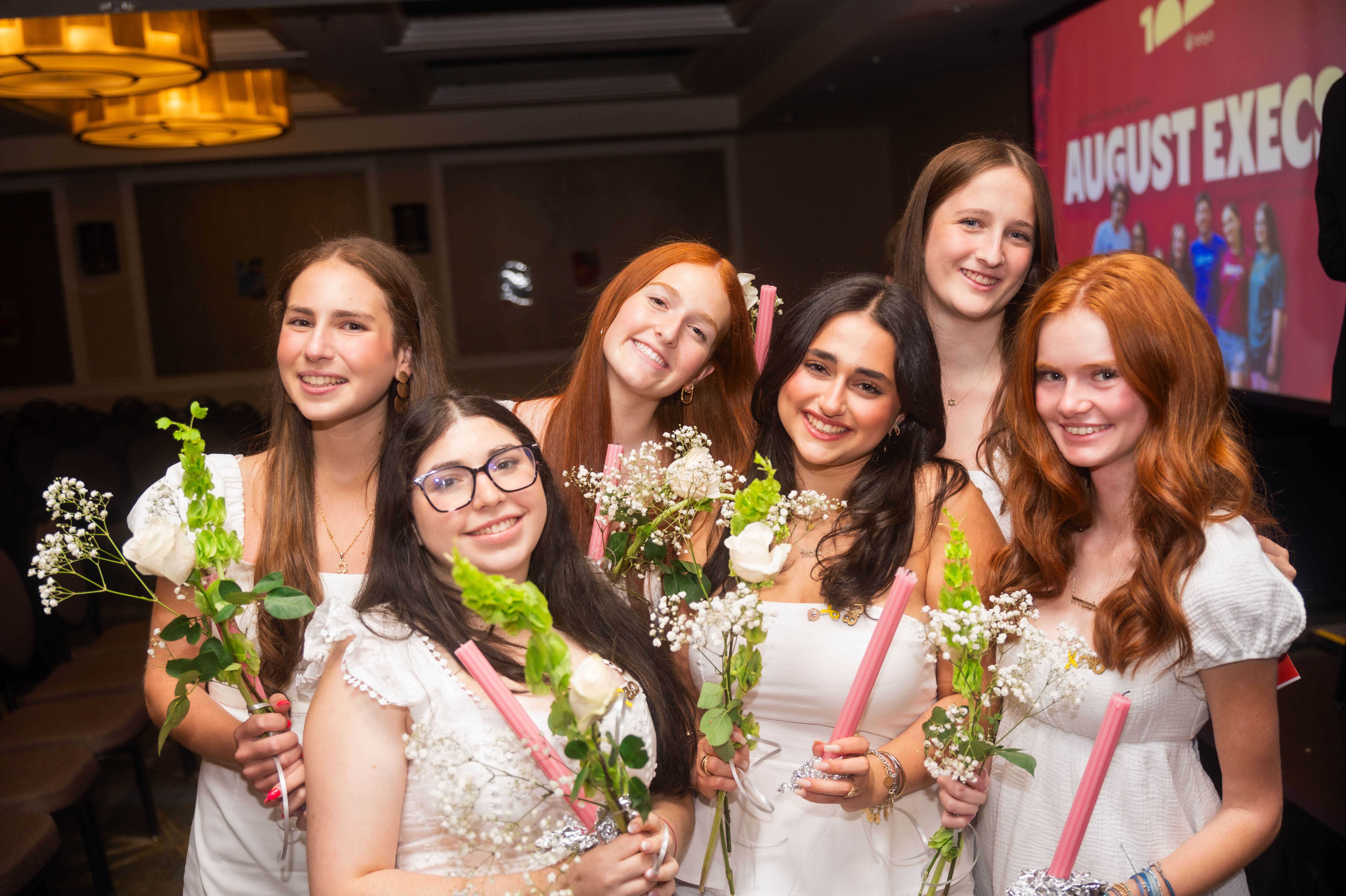 Group of people celebrating on stage