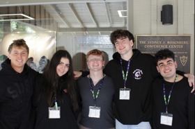 Group of people celebrating on stage