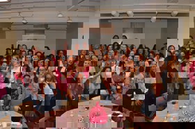 Group of people celebrating on stage