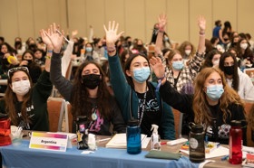 Group of people celebrating on stage