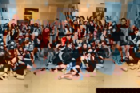 Group of people celebrating on stage