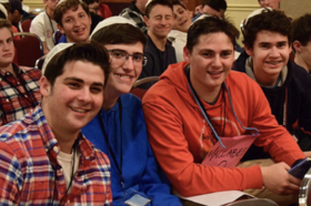 Group of people celebrating on stage
