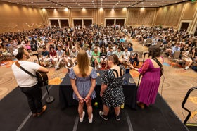 Group of people celebrating on stage