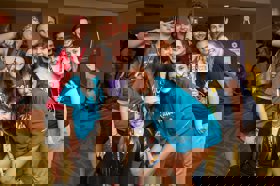 Group of people celebrating on stage