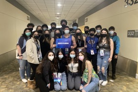 Group of people celebrating on stage