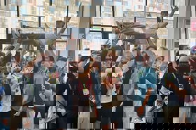 Group of people celebrating on stage