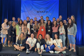 Group of people celebrating on stage