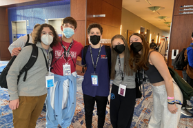 Group of people celebrating on stage