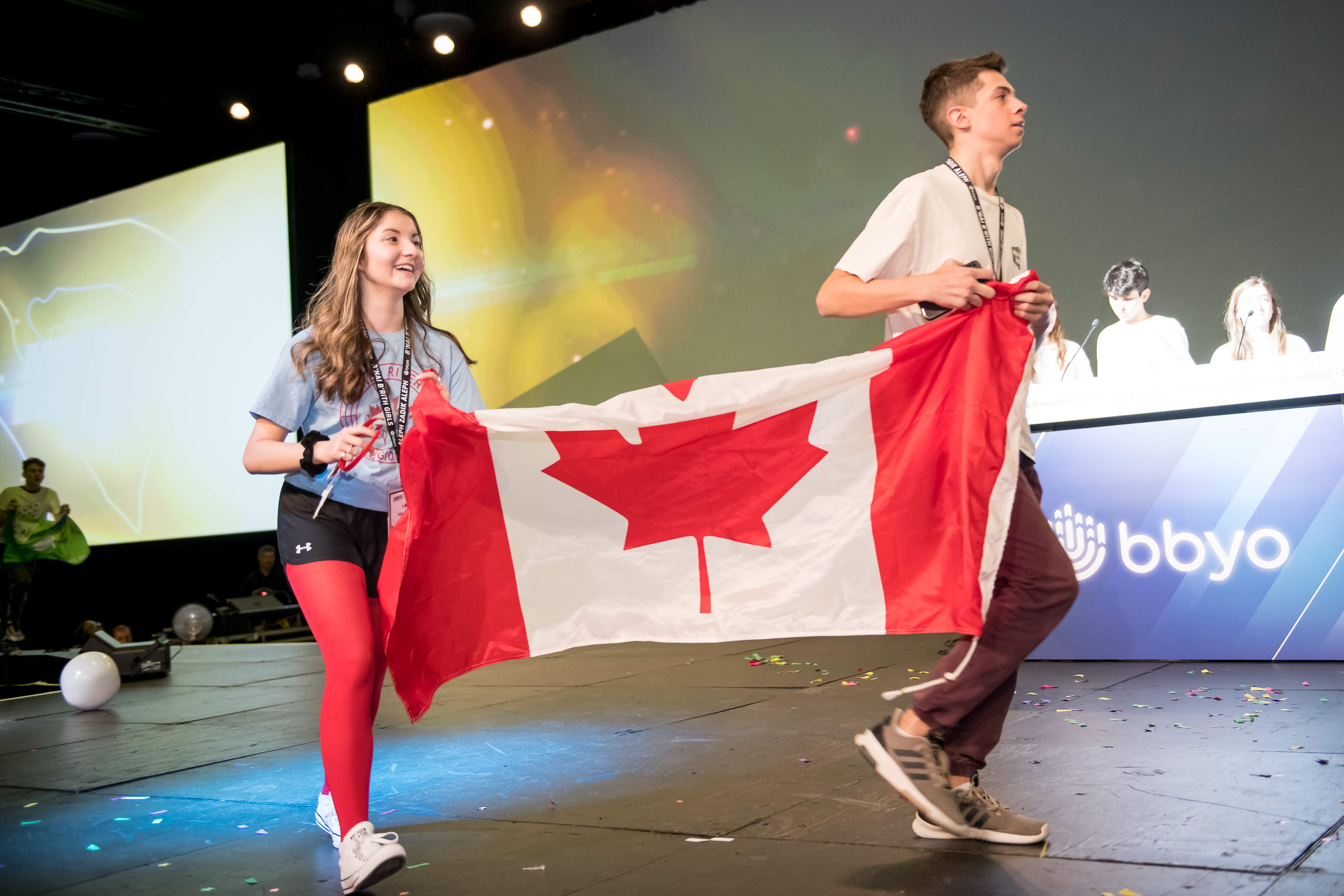 Group of people celebrating on stage