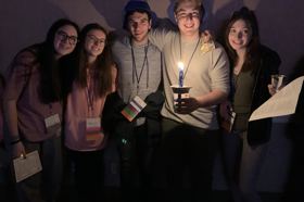 Group of people celebrating on stage