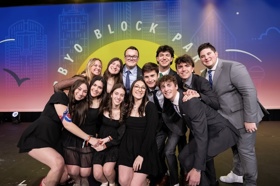 Group of people celebrating on stage