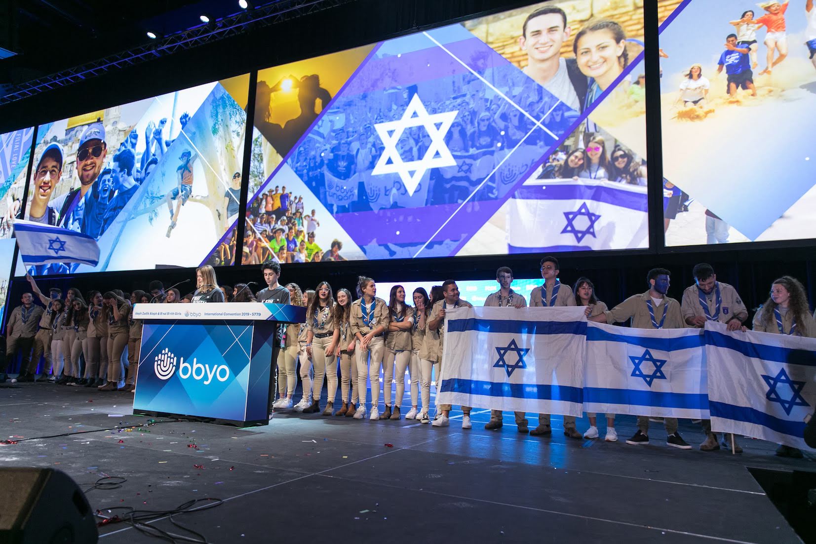 Group of people celebrating on stage