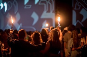 Group of people celebrating on stage