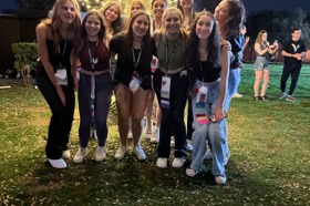 Group of people celebrating on stage