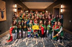 Group of people celebrating on stage