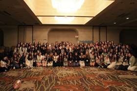 Group of people celebrating on stage